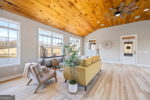 living room with lofted ceiling, wood ceiling, and light hardwood / wood-style flooring