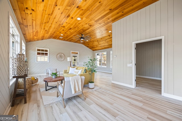 living room featuring wood ceiling, vaulted ceiling, ceiling fan, and light wood-type flooring