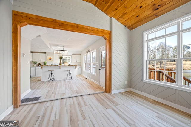 unfurnished sunroom with wood ceiling