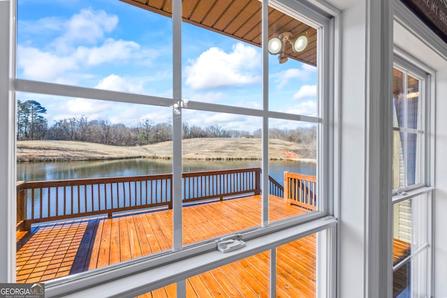 sunroom with a water view