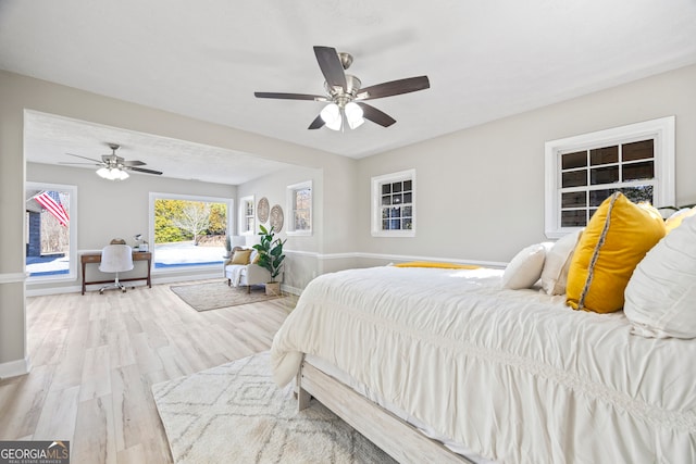 bedroom featuring ceiling fan and light hardwood / wood-style flooring