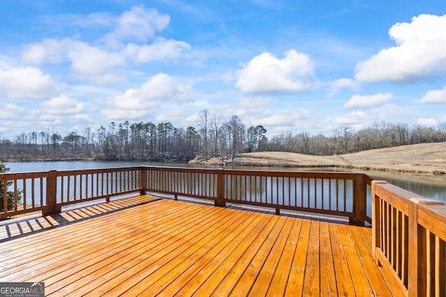 wooden terrace with a water view