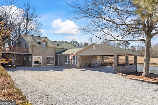 view of front of home with a carport