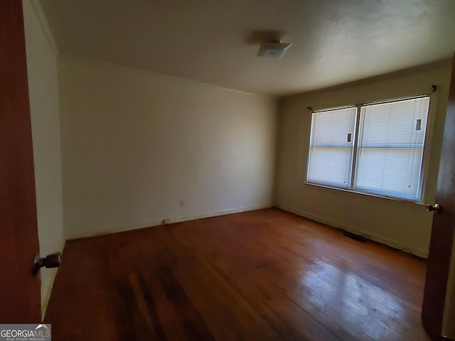 empty room with wood-type flooring