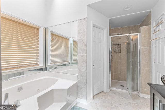 bathroom with shower with separate bathtub