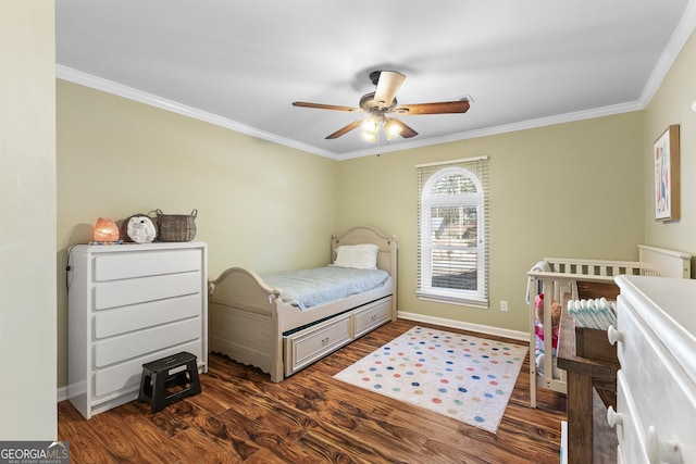 bedroom with dark wood-type flooring, ornamental molding, and ceiling fan