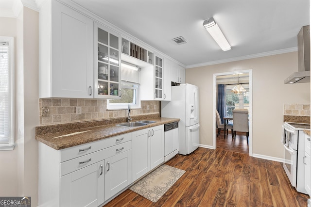 kitchen featuring dishwashing machine, sink, dark hardwood / wood-style floors, and white cabinets