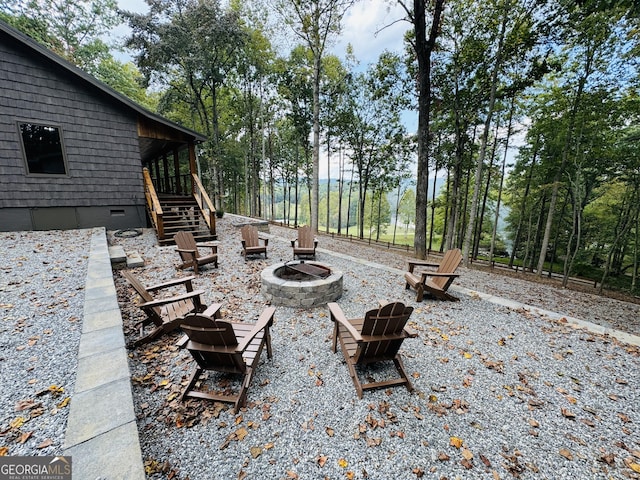 view of patio / terrace featuring an outdoor fire pit