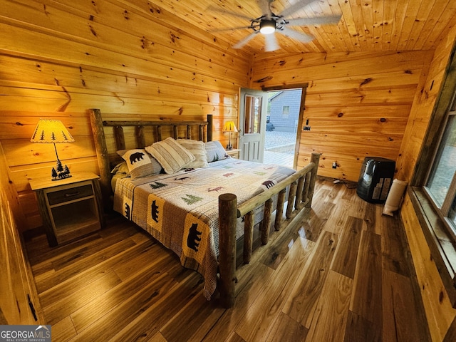 bedroom with access to exterior, wooden walls, wooden ceiling, and dark hardwood / wood-style floors