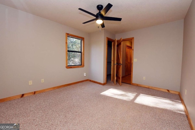 unfurnished bedroom featuring ceiling fan and light colored carpet