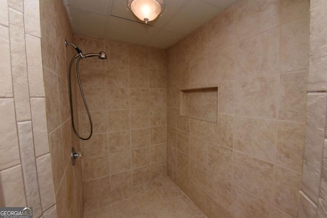 bathroom with a tile shower