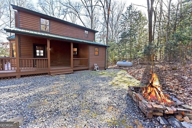 exterior space with a fire pit