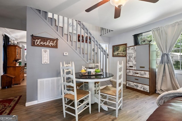 dining area featuring ceiling fan and hardwood / wood-style floors