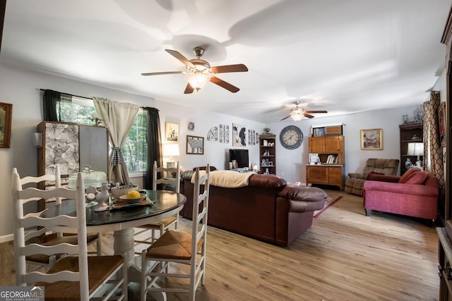 dining room featuring ceiling fan and light wood-type flooring