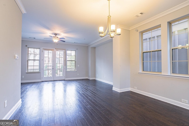 unfurnished room featuring dark hardwood / wood-style floors, ceiling fan with notable chandelier, ornamental molding, and french doors