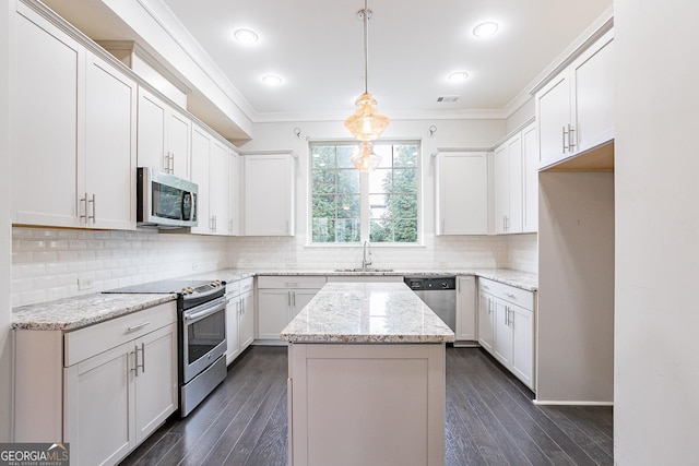 kitchen with white cabinetry and appliances with stainless steel finishes