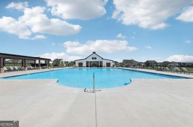 view of swimming pool featuring a patio area