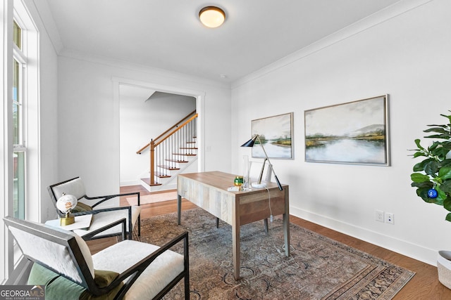 home office with crown molding and dark wood-type flooring