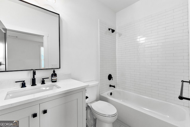 full bathroom featuring vanity, toilet, and tiled shower / bath