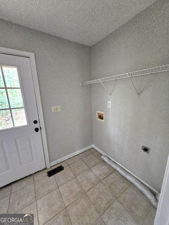 laundry room with washer hookup, hookup for an electric dryer, and tile patterned flooring