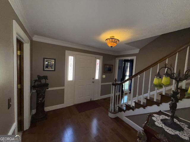 entryway featuring dark hardwood / wood-style flooring and crown molding