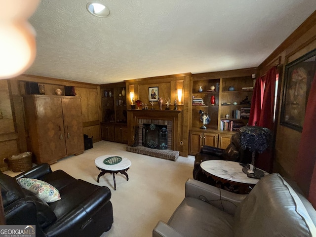 living room featuring built in features, a fireplace, a textured ceiling, light colored carpet, and wood walls