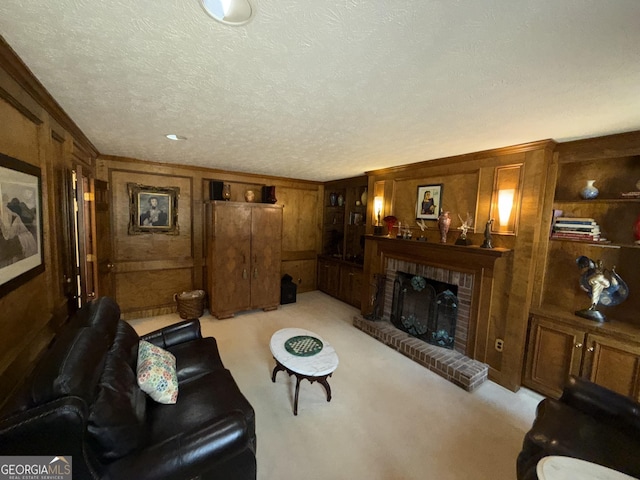 carpeted living room with crown molding, a brick fireplace, wooden walls, and a textured ceiling