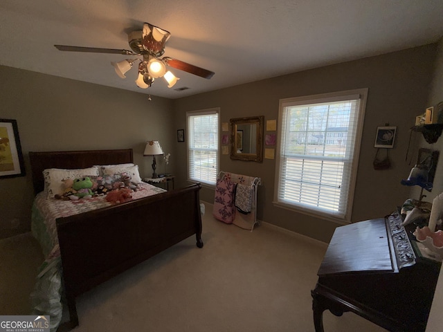 carpeted bedroom with ceiling fan