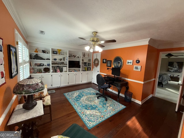 living room featuring ornamental molding, dark wood-type flooring, ceiling fan, and a textured ceiling