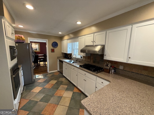 kitchen with stainless steel appliances, white cabinetry, sink, and crown molding