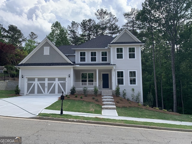 7406 Grand Reunion Dr, Hoschton, GA 30548 - view of front of home featuring covered porch, a garage, concrete driveway, a front lawn, and a shingled roof