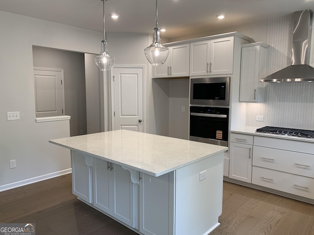 7406 Grand Reunion Dr, Hoschton, GA 30548 - kitchen featuring oven, wall chimney range hood, stainless steel gas stovetop, a kitchen island, and built in microwave