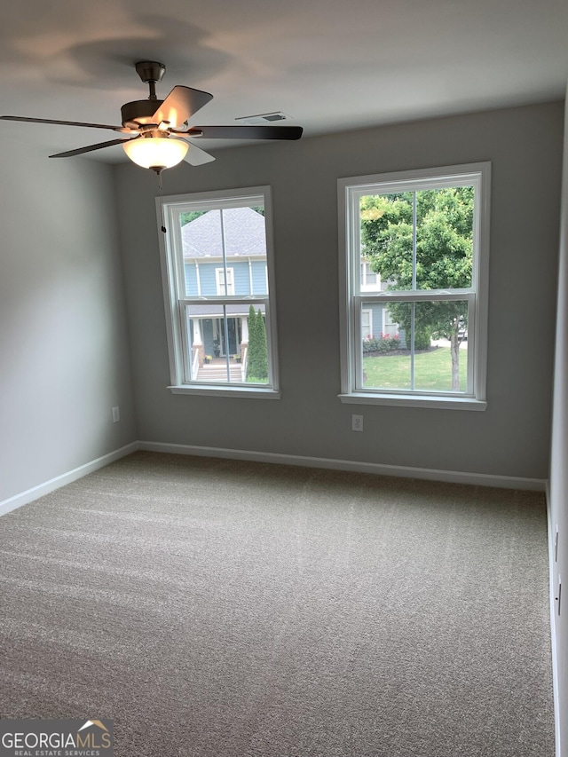 7406 Grand Reunion Dr, Hoschton, GA 30548 - carpeted spare room featuring ceiling fan and baseboards