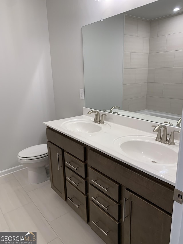 7406 Grand Reunion Dr, Hoschton, GA 30548 - bathroom with double vanity and toilet