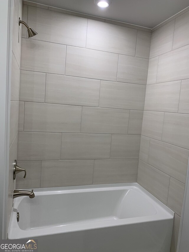 7406 Grand Reunion Dr, Hoschton, GA 30548 - bathroom with shower / tub combination and recessed lighting
