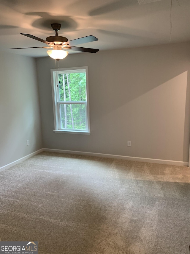 7406 Grand Reunion Dr, Hoschton, GA 30548 - carpeted spare room with ceiling fan and baseboards