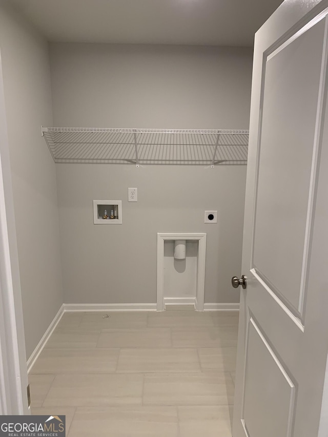 7406 Grand Reunion Dr, Hoschton, GA 30548 - laundry area with electric dryer hookup, baseboards, and washer hookup