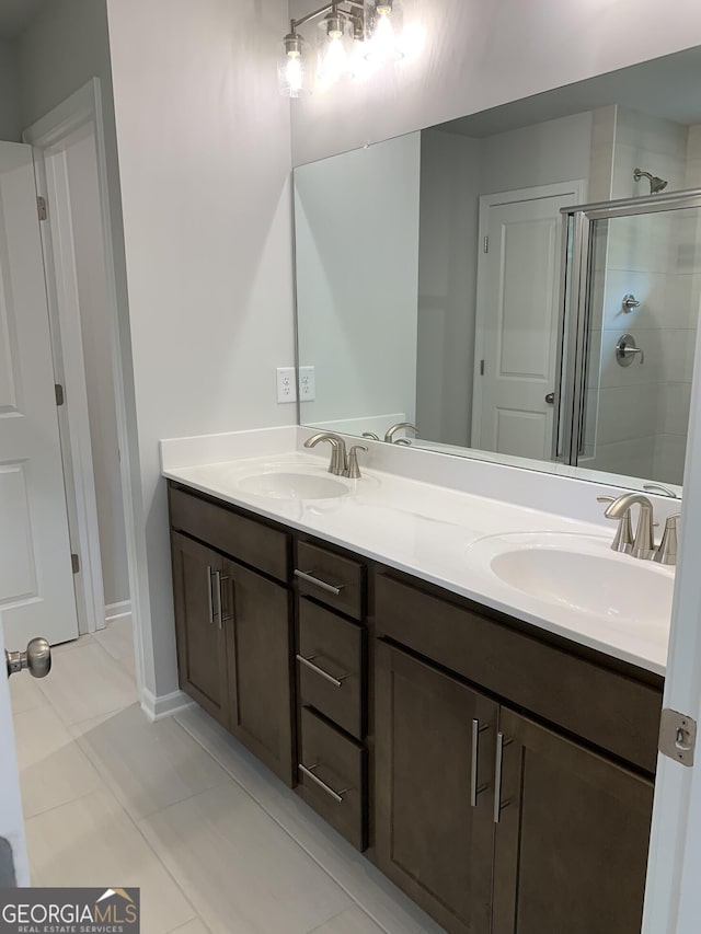 7406 Grand Reunion Dr, Hoschton, GA 30548 - bathroom with a shower stall, tile patterned flooring, and double vanity