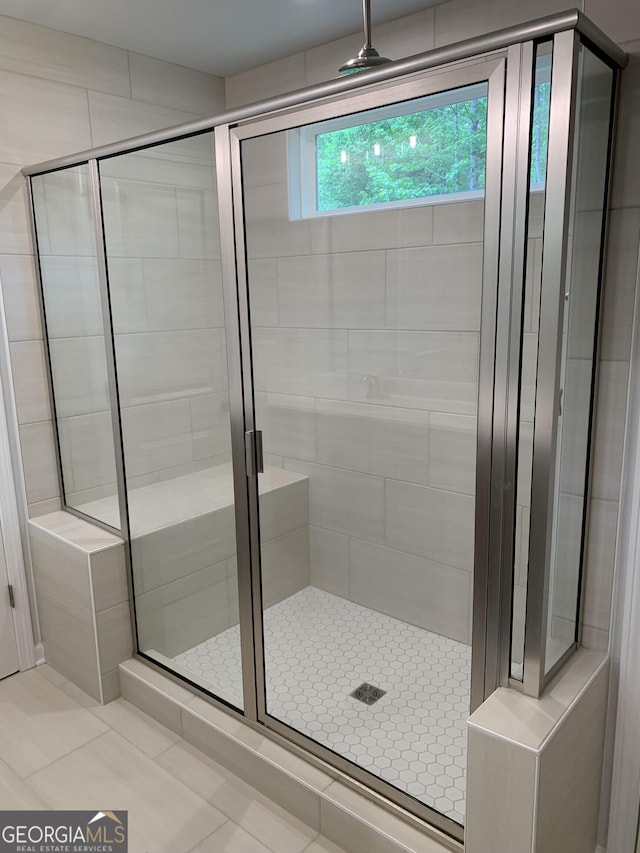 7406 Grand Reunion Dr, Hoschton, GA 30548 - bathroom featuring a stall shower and tile patterned flooring