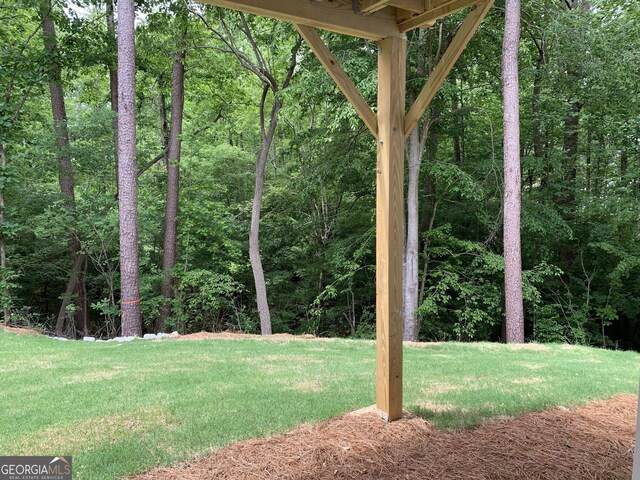 7406 Grand Reunion Dr, Hoschton, GA 30548 - view of grassy yard with a forest view