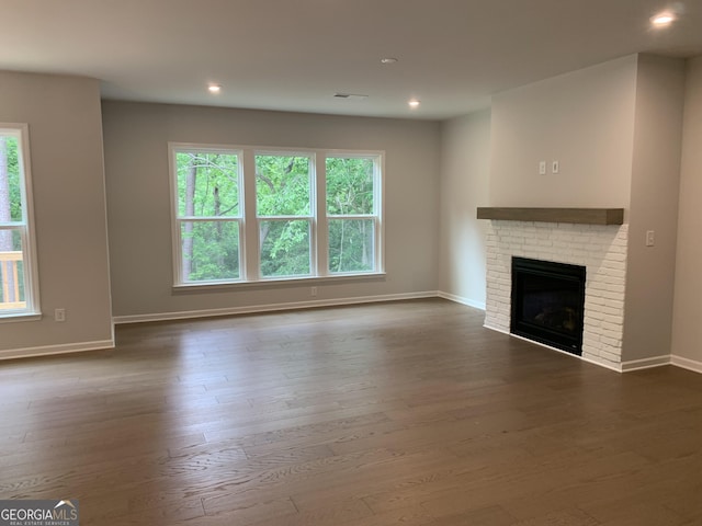 7406 Grand Reunion Dr, Hoschton, GA 30548 - unfurnished living room with plenty of natural light, dark wood finished floors, baseboards, and recessed lighting