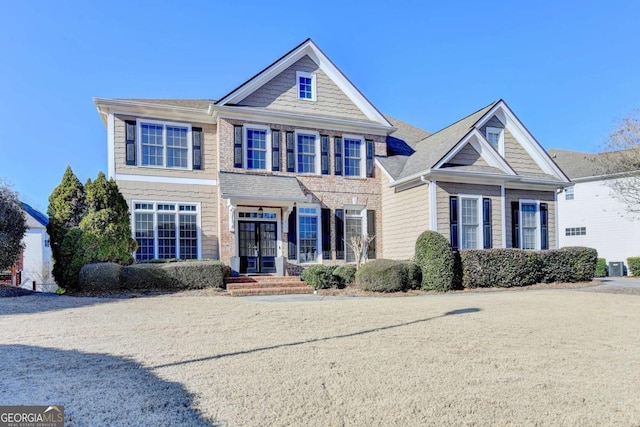 view of front of home featuring central AC unit