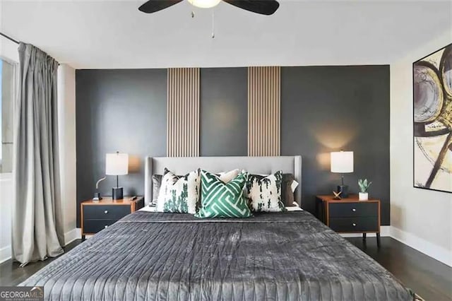 bedroom featuring ceiling fan and dark hardwood / wood-style flooring