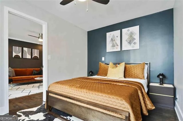 bedroom featuring tile patterned flooring and ceiling fan