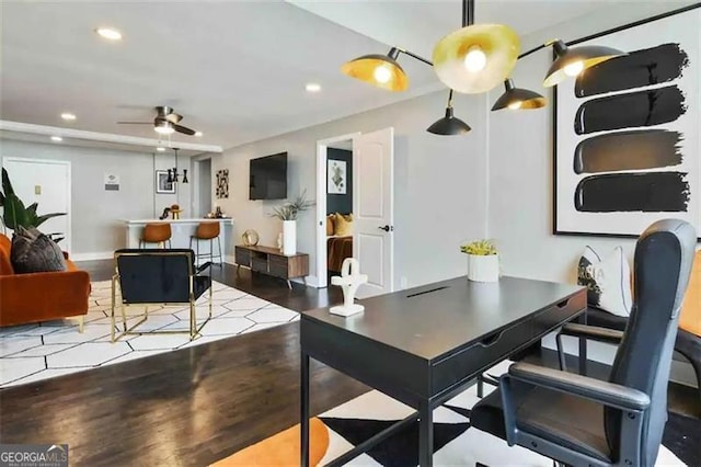 dining area with dark wood-type flooring and ceiling fan