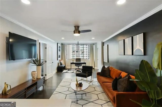 living room with ornamental molding and ceiling fan