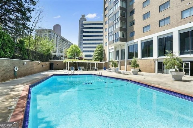 view of pool featuring a patio area