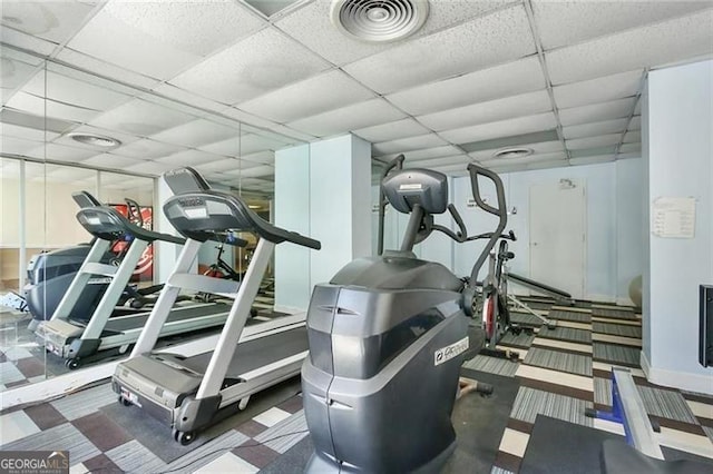 workout area featuring a paneled ceiling