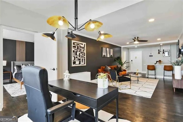 dining room featuring ornamental molding, dark hardwood / wood-style floors, and ceiling fan