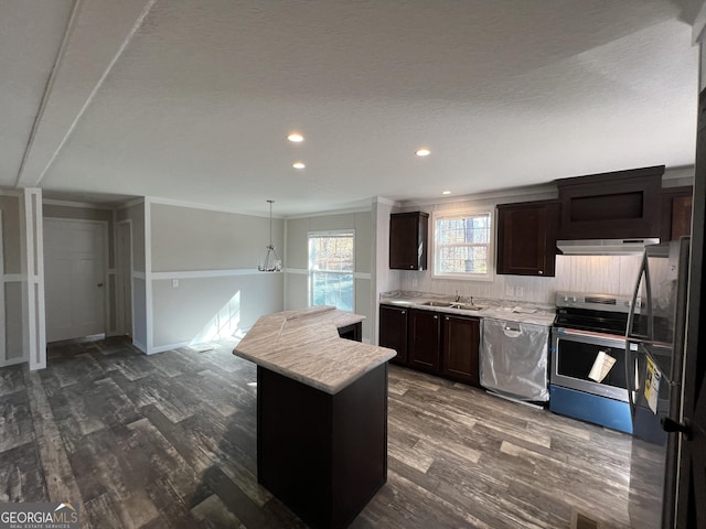 kitchen featuring sink, hanging light fixtures, dark hardwood / wood-style flooring, a kitchen island, and stainless steel appliances